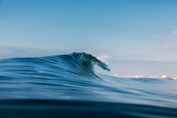 Barrel wave for surfing in ocean. Breaking transparent wave - obrazy, fototapety, plakaty