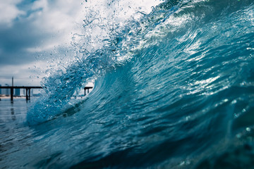 Barrel wave for surfing in ocean. Breaking transparent wave