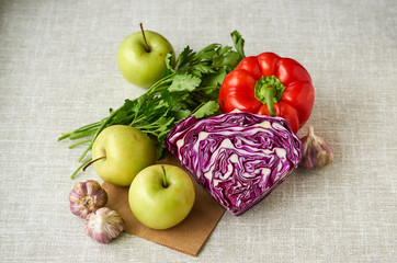 Various vegetables and fruits on a gray background