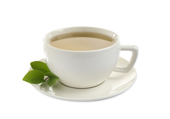 Cup of green tea and leaves isolated on white