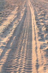 tire tracks in the sand