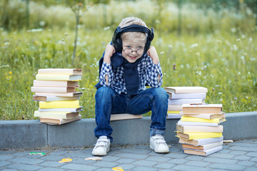 Little boy in headphones. Back to school. The concept of learning, school, mind, lifestyle and...