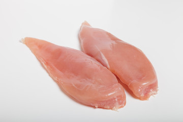 Raw chiken meat on a light background