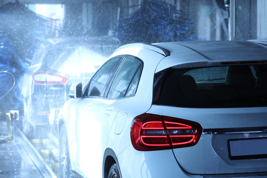 Modern Auto Undergoing Cleaning At Car Wash