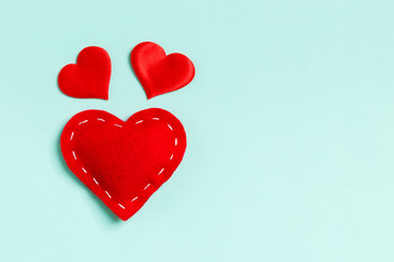 Top view of red textile hearts on colorful background with copy space. Romantic concept. St Valentine's Day