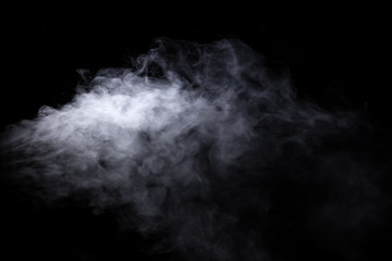 Jet of smoke on black background. Selective focus