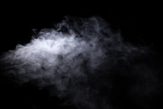 Jet Of Smoke On Black Background. Selective Focus