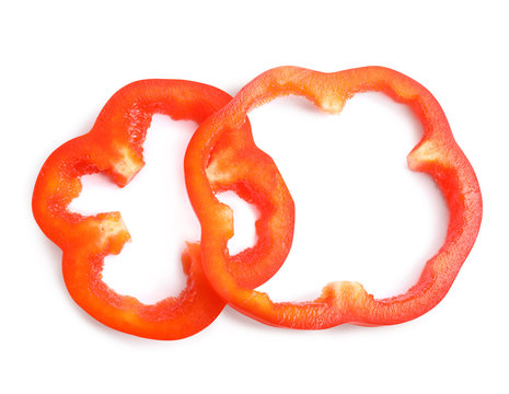 Slices of red bell pepper isolated on white