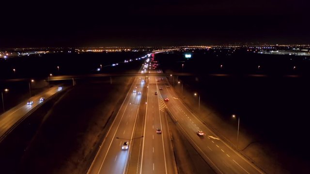 Drone fired at a night freeway with cars and bandages in a suburb of Bankok.