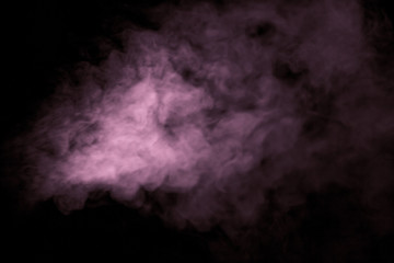 Jet of smoke on black background. Selective focus. Toned
