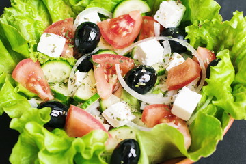 fresh salad with cheese and black olives