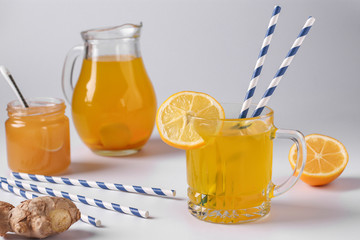 Homemade healthy drink with lemon, ginger, honey and turmeric on a white background, , Horizontal orientation