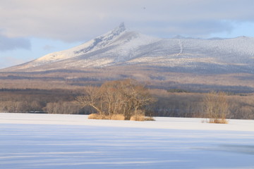 winter landscape with lake and mountains in winter
