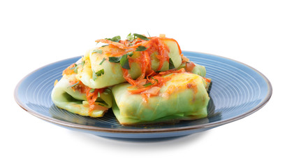 Delicious cabbage rolls with sauce isolated on white