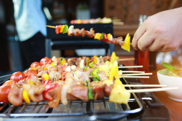 Naklejka premium Barbeque Grill Street Food in thailand,Eat outdoors in a happy family.