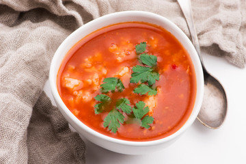 Tomato soup with rice decorated with parsley