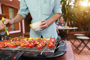 Barbeque Grill Street Food in thailand,Eat outdoors in a happy family.