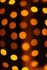 Yellow background with soft round bokeh lanterns.