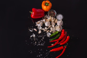 Bell and chili peppers. Condiments and garlic. Vegetable flatlay.