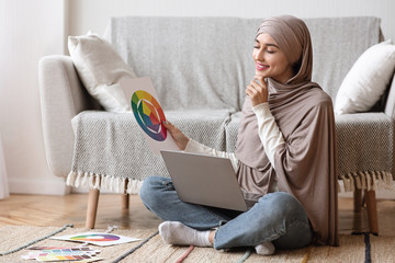 Young Muslim Woman Choosing Color Gamma For Her Interior