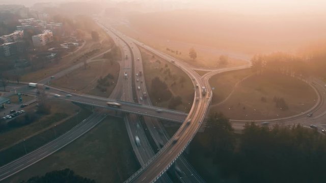 Traffic aerial hyperlapse, sunrise morning traffic rush. Highway intersection. Vilnius, Lithuania