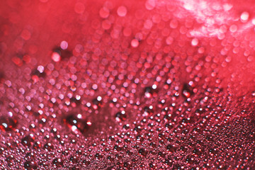 abstract red background with bokeh and  drops of water