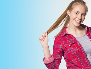 Portrait of teen girl showing dental braces.