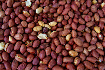 freshly roasted salted peanuts background