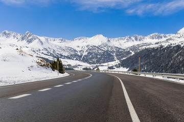 Panoramic road view and winter snow landscape mountain view in Andorra, Pyrenees mountains, South Europe. Andorra is famous tourist travel destination. Luxury amazing resort for skiing and winter rest