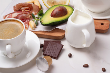 Obraz na płótnie Canvas oatmeal, coffee, avocado, chocolate closeup on a white background