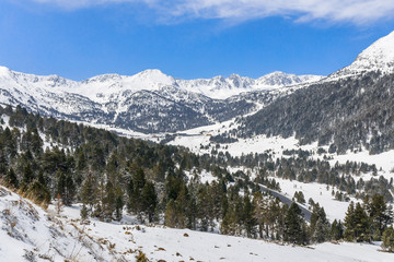 Panoramic winter snow landscape mountain view in Andorra, valley of Pyrenees mountains, South Europe. Andorra is a famous tourist travel destination. Luxury amazing resort for skiing and winter rest