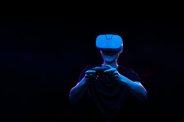 Man with virtual reality headset is playing game.