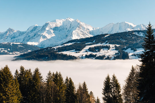 the valley at Sallanches covered with fog on a sunny bright day in the French Mont Blanc massive