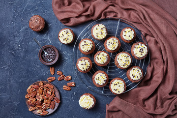 Chocolate cupcakes on a metal rack, flat lay