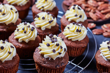 Chocolate cupcakes on a metal rack, close-up