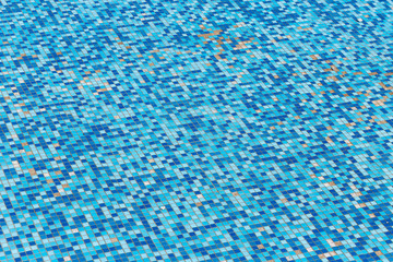 Damaged surface with blue square tile mosaic. Broken surface with missing pieces of tiles.