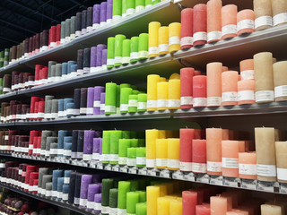 KYIV, UKRAINE - DECEMBER 20, 2019: Supermarket in Kiev. Multicolor store front or supermarket with decorative candles -  shopping, sale, consumerism aconcept. Aromatic colorful new candles in a row.