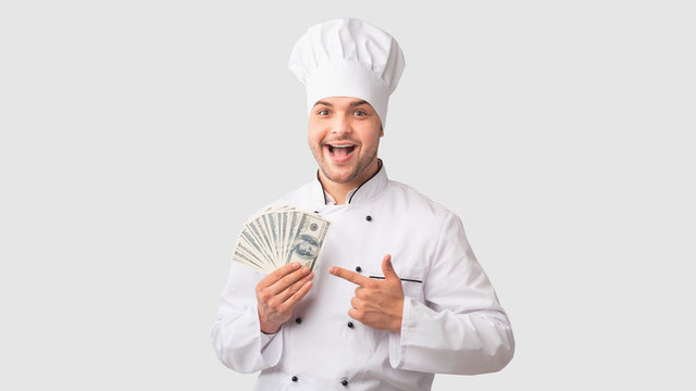 Chef Man Holding Money Pointing Finger Standing Over White Background