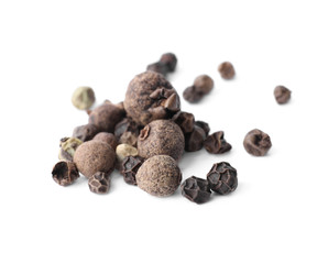 Mix of different pepper grains isolated on white