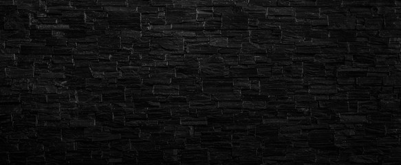 Fototapeta na wymiar Old black brick wall texture background,brick wall texture for for interior or exterior design backdrop,vintage dark tone.