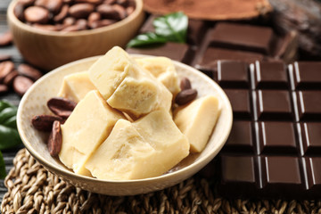 Aromatic organic cocoa butter on table, closeup