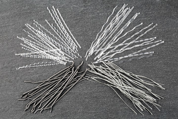 Close up, top down view of a set of four different types concrete reinforcement macro fibers -...