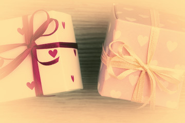 Close up of two gift boxes on Valentines day. Vintage stylized photo