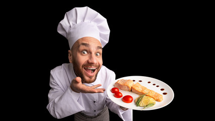 Funny Chef Serving Fish Dish On Black Background, Panorama, High-Angle