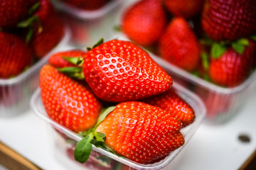 fresh strawberries close up within the fruits market in Prague
