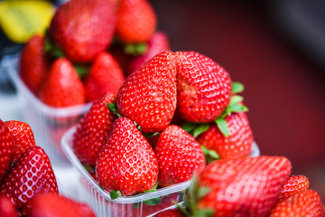 fresh strawberries close up within the fruits market in Prague