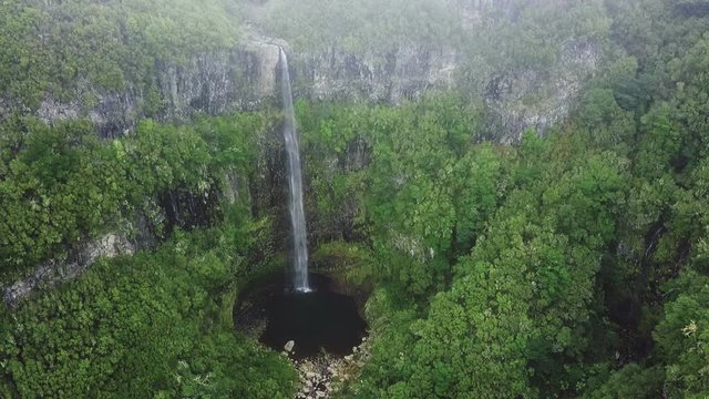 Aerial drone view of "Lagoa do Vento" waterfall in "Paul da Serra", Madeira island, Portugal