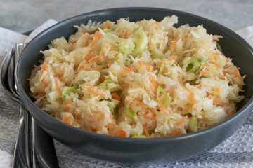 Fresh salad of raw cabbage, leeks and carrots, multivitaminico natural food