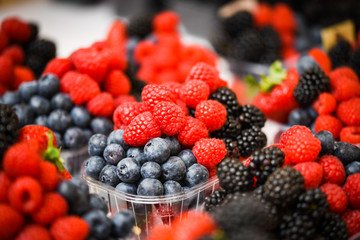 fresh berries close up - strawberries, blueberries, red berries, raspberry, black berries 