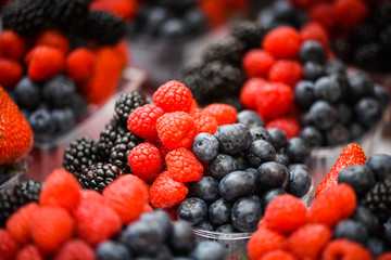 fresh berries close up - strawberries, blueberries, red berries, raspberry, black berries 
